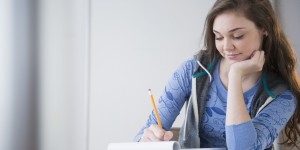 Hispanic girl studying at desk