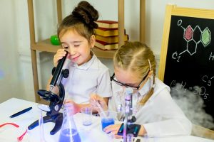 kids making science experiments in laboratory. education